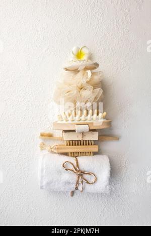 Spa and bathroom accessories, towel, massage brushes, soap, washcloth. Spa and massage products set conception. Tower-shaped items Top veiw Stock Photo