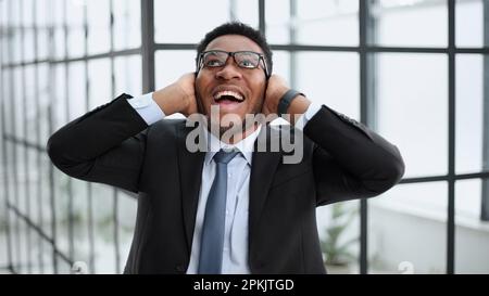 Photo of a young excited guy rejoicing in luck, Stock Photo