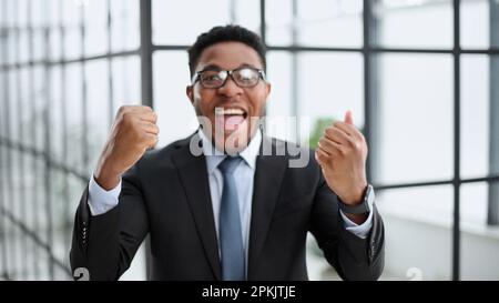 Happy confident black guy posing for headshot face front close up portrait. Stock Photo
