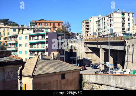 Buildings  next to an overpass in a city on a cloudy day Stock Photo