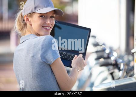 woman bike mechanic working on bicycle Stock Photo