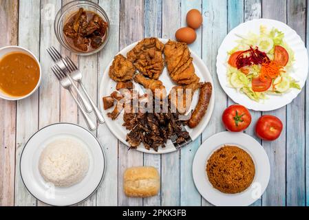 Set of Dominican food recipes with arroz moro, asado, salad and white rice Stock Photo