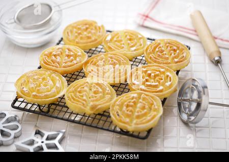 rosette cookies( circle ) on a cake cooling rack Stock Photo