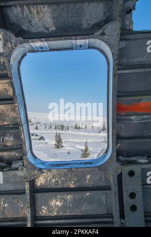Looking out the window from Miss Piggy Curtiss C-46 Commando crashed aircraft in Churchill, Manitoba, Canada Stock Photo