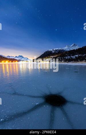 Cracked ice on the frozen surface of Lake Champfer in winter, Silvaplana, Engadine, canton of Graubunden, Switzerland, Europe Stock Photo