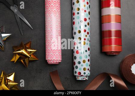 Colorful gift wrapping bows and silver sequins on white festive