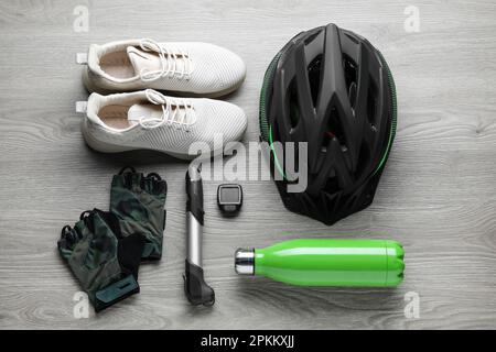 Flat lay composition with different cycling accessories on wooden background Stock Photo