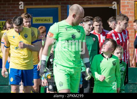 Warrington, Cheshire, England. 8th April 2023. The two teams (Warrington Town & Ashton United) walk out, during Warrington Town Football Club V Aston United Football Club at Cantilever Park at Cantilever Park, in the Northern Premier League Premier Division. (Credit Image: ©Cody Froggatt/Alamy Live News) Stock Photo