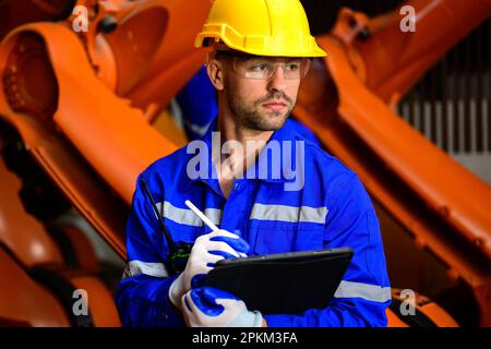Expertise technicians workers working at industrial plant Stock Photo