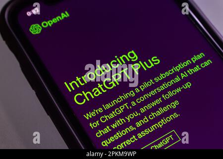 ChatGPT Plus website on iPhone. Plan that offers availability of faster response speed when demand is high & priority access to new features Stock Photo