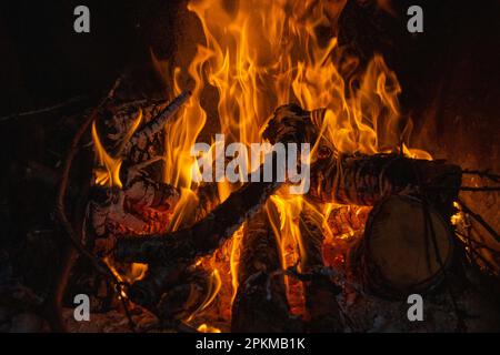 Burning flames in a fireplace in a country house Stock Photo