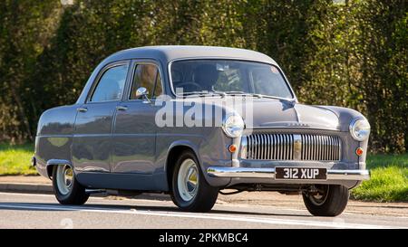 1953 grey Ford Consul classic car travelling on an English country road Stock Photo