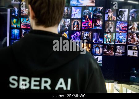 Moscow, Russia. 8th of April, 2023. A young man presents the Kandinsky 2.1 neural network (artificial intelligence for image generation) at the international fair of intellectual literature 'non/fictioN spring' in Gostiny Dvor exhibition center in Moscow, Russia Stock Photo