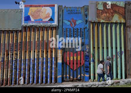 Tijuana, Baja California, Mexico. 7th Apr, 2023. Life in Playas de Tijuana's beach border between the U.S. and Mexico with a new mural in protest of the deconstruction of Friendship Park showing Trump and U.S. President Biden kissing, painted by Mexican artists Cuauhtli and Salazar on Friday. This mural is a comparison of the original picture depicting Brezhnev, leader of the USSR and Honecker of East Germany in a socialist fraternal kiss, reproducing a photograph taken in 1979 during the 30th anniversary celebration of the foundation of the German Democratic Republic. (Credit Image: © Carlos Stock Photo