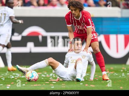 Kiliann Sildillia, FRG 25  compete for the ball, tackling, duel, header, zweikampf, action, fight against Jamal MUSIALA, FCB 42  in the match SC FREIBURG - FC BAYERN MUENCHEN 0-1 1.German Football League on Apr 8, 2023 in Freiburg, Germany. Season 2022/2023, matchday 27, 1.Bundesliga, FCB, BVB, München, 27.Spieltag. © Peter Schatz / Alamy Live News    - DFL REGULATIONS PROHIBIT ANY USE OF PHOTOGRAPHS as IMAGE SEQUENCES and/or QUASI-VIDEO - Stock Photo