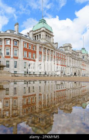 Old Admiralty Building London reflects in a puddle on Horse Guards Parade Stock Photo
