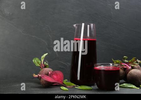 Freshly made beet juice on black table Stock Photo