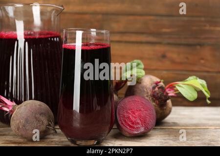 Freshly made beet juice on wooden table Stock Photo