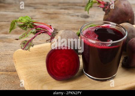 Freshly made beet juice on wooden table Stock Photo