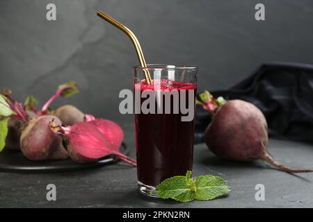 Freshly made beet juice on black table Stock Photo