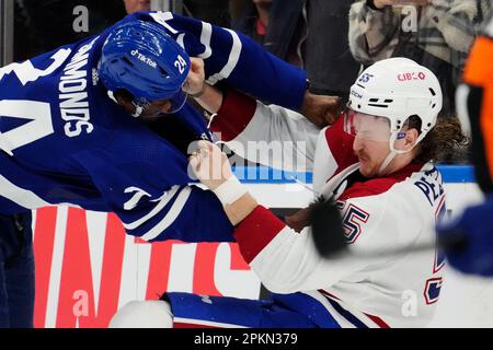Toronto Maple Leafs forward Kurtis Gabriel (29) fights Montreal Canadiens  forward Michael Pezzetta (55) during the third period of an NHL preseason  hockey game, Tuesday, Oct. 5, 2021 in Toronto. (Nathan Denette/The