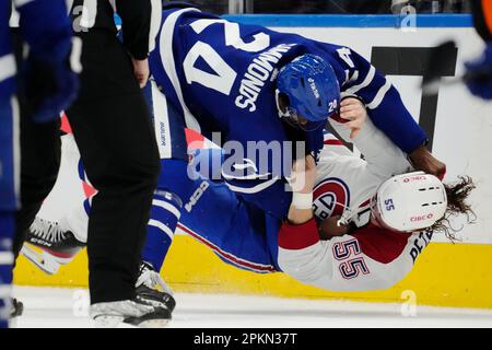 Toronto Maple Leafs forward Kurtis Gabriel (29) fights Montreal Canadiens  forward Michael Pezzetta (55) during the third period of an NHL preseason  hockey game, Tuesday, Oct. 5, 2021 in Toronto. (Nathan Denette/The