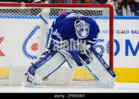 Toronto Maple Leafs goaltender Ilya Samsonov (35) makes a save against  Montreal Canadiens' Justin Barron (52) as Leafs' Spencer Sova (61) skates  in during first-period preseason NHL hockey game action in Montreal