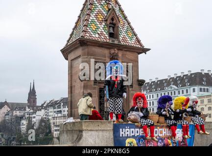 Waggis mask costume sitting on the Mittlere Brucke bridge at the Basel Fasnacht carnival in Switzerland Stock Photo