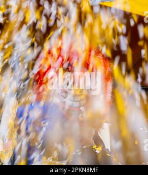 Waggis costume inside a parade float throwing confetti at the Basel Fasnacht carnival in Switzerland Stock Photo