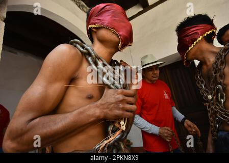 Atlixco, Mexico. 07th Apr, 2023. April 7, 2023, Atlixco, Mexico - Hooded Penitents, wearing heavy chains and cactus spines stuck to their bodies, take part in the Holy Week penitential procession The 'Engrillados' ( Shackled) procession to celebrated the Good Friday as part of holy week celebration. on April 7, 2023 in Atlixco, Mexico. (Photo by Carlos Tischler/Eyepix Group/Sipa USA) Credit: Sipa USA/Alamy Live News Stock Photo