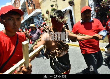 Atlixco, Mexico. 07th Apr, 2023. April 7, 2023, Atlixco, Mexico - Hooded Penitents, wearing heavy chains and cactus spines stuck to their bodies, take part in the Holy Week penitential procession The 'Engrillados' ( Shackled) procession to celebrated the Good Friday as part of holy week celebration. on April 7, 2023 in Atlixco, Mexico. (Photo by Carlos Tischler/Eyepix Group/Sipa USA) Credit: Sipa USA/Alamy Live News Stock Photo