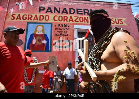 Atlixco, Mexico. 07th Apr, 2023. April 7, 2023, Atlixco, Mexico - Hooded Penitents, wearing heavy chains and cactus spines stuck to their bodies, take part in the Holy Week penitential procession The 'Engrillados' ( Shackled) procession to celebrated the Good Friday as part of holy week celebration. on April 7, 2023 in Atlixco, Mexico. (Photo by Carlos Tischler/Eyepix Group/Sipa USA) Credit: Sipa USA/Alamy Live News Stock Photo