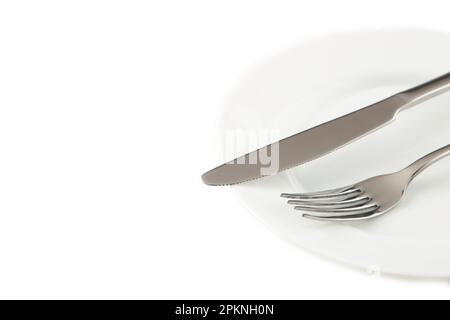 Dining etiquette - the meal is over or finished. Fork and knife signals with location of cutlery set. Photo isolated on white background. Set of foto Stock Photo