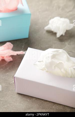 Two tissue box on grey background. Top view Stock Photo