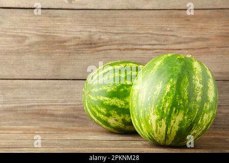 Two fresh watermelons on grey background with copy space . Top view Stock Photo