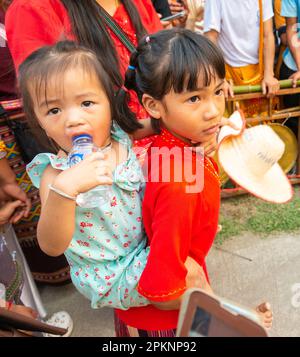 Pai,Northern Thailand-April 4th 2023: Large crowds,including many Thai families,attend the coming of age ceremony,where boys are ordained to be Buddhi Stock Photo