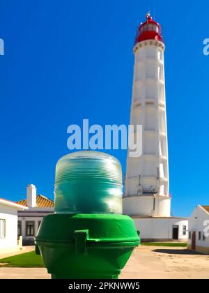 Lighthouse of the island Farol at the Algarve coast of Portugal Stock Photo