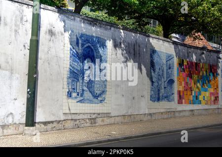 Coimbra, Portugal - August 15, 2022: Street view showing wall with sections of ceramic tiling Stock Photo