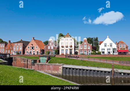 Historic gabled houses in the fishing port of Greetsiel, Krummhörn, East Frisia, Lower Saxony, Germany, Europe Stock Photo