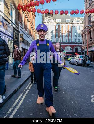 Waluigi from The Super Mario Bros. Movie comes out to play in London's Chinatown. Stock Photo