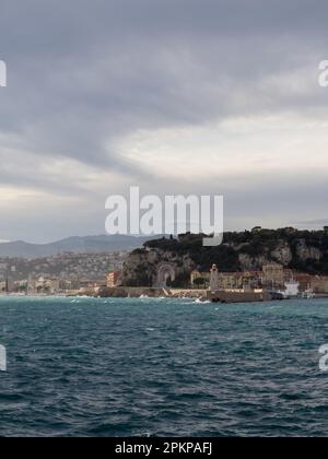 NICE, FRANCE- CIRCA MARCH, 2023: Nice port lighthouse with cloudy sky, travel content Stock Photo