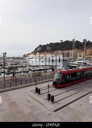 NICE, FRANCE- CIRCA MARCH, 2023: Red tram in Port Lympia station on a 2 line, travel content Stock Photo