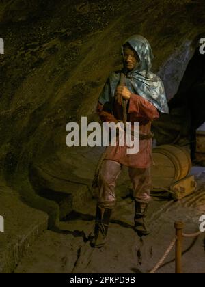 Wieliczka, Poland - June 2022: Interior of a salt mine. Characters showing various situations in the life of a salt mine. Europe Stock Photo