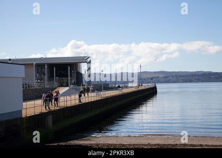 View of Helensburgh Pier on the River Clyde Scotland, with the leisure centre to the left. Stock Photo