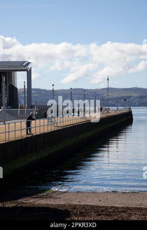 View of Helensburgh Pier on the River Clyde Scotland, with the leisure centre to the left. Stock Photo