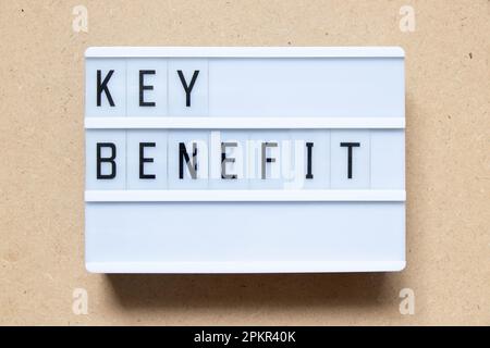 Lightbox with word key benefit on wood background Stock Photo