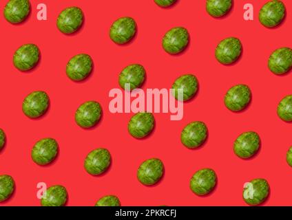 Pattern made with green Easter Eggs on red Background. Creative Layout. Top view. Stock Photo