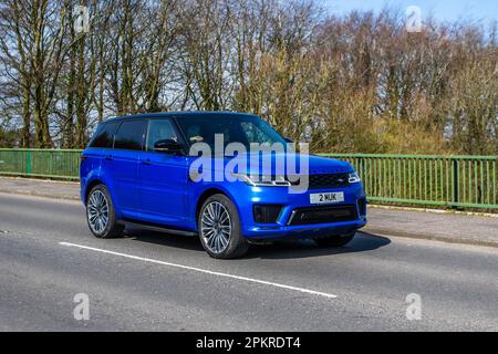 2020 Blue Land Rover R over Sport A-Bio Dyn Sdv6 A, SDV6 306 Commandshift Auto Start/Stop crossing motorway bridge in Greater Manchester, UK Stock Photo