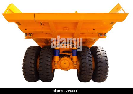 Mining dump modern truck of yellow color isolated on a white background. Back view. Stock Photo