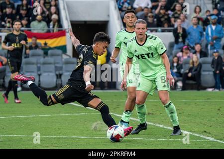 LAFC defender Erik Dueñas (18) takes a shot on goal against Austin FC midfielder Alexander Ring (8) during a MLS match, Saturday, April 8, 2023, at th Stock Photo